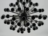 a black and white photo of a large chandelier