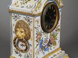 a clock with a lion ' s head on it