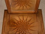 a small wooden box with a star design on it