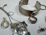 many different pieces of jewelry that are on the table