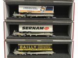 six model train cars are stacked on top of each other in a display case