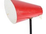an image of a red and white lamp on a black pole