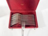 silverware in a red case with forks and spoons in it