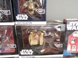 boxes of star wars action figures are stacked on top of each other