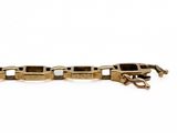 an image of a close up of a gold bracelet on a white background