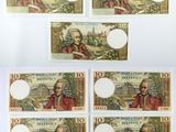 a group of five different bills with a picture of a man and a woman on them