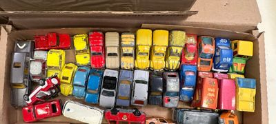 a lot of toy cars in a box on the floor