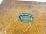 a piece of wood that has a piece of wire attached to it