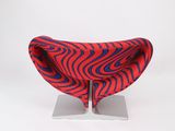an image of a red and blue chair on a metal stand