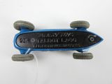 a small blue skateboard with wheels on a white surface