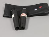 a pair of black binoculars sitting on top of a black case