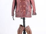 leather coat and boots on a stand on a white background