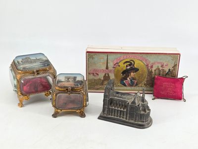 a small box with a picture on it next to other items