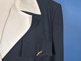 a close up of a black and white jacket on a mannequin