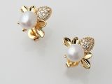 a pair of pearl and diamond earrings