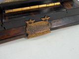 a wooden box with a clock on top of it
