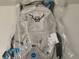 a backpack that is wrapped in plastic on a table