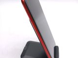 a cell phone that is sitting on a stand