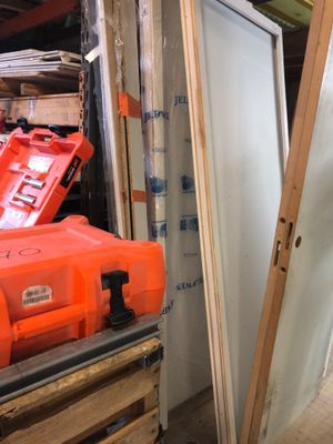 a red toolbox sitting on top of a pallet in a room