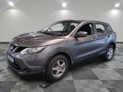 a picture of a grey nissan suv parked in a garage
