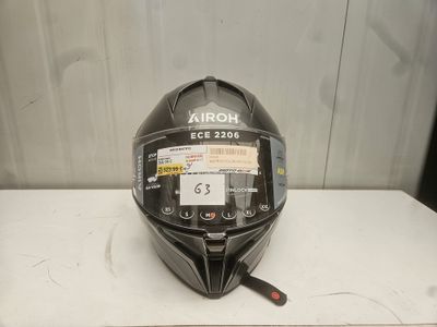 the helmet is black and has a sticker on it