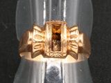 une image représentant une bague en or sertie d'une citrine