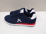 men ' s navy and white sneakers with red accents on the sole