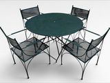 four chairs and a table with a green table top