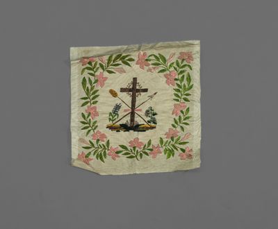 a close up of a piece of cloth with a cross on it