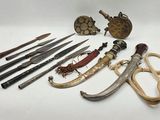 many different types of knives and other items on the table