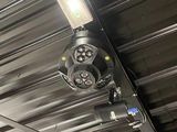two lights that are hanging from the ceiling of a building