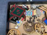 a box filled with assorted medals and other items