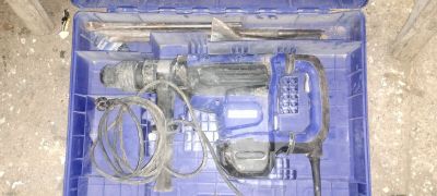 a blue box with tools in it on the floor