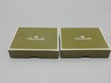 a pair of green boxes with white lettering on them