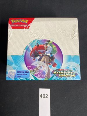 a close up of a box of pokemon trading cards on a table