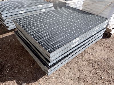 several steel grates stacked on top of each other in a pile