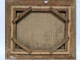 an old wooden picture frame with a piece of burlock on it