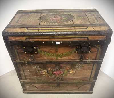 an old wooden chest sitting on top of a white table