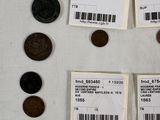 some coins are sitting on a table with a barcode on them