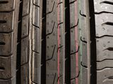 a close up of a tire with a red stripe on it