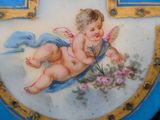 a blue plate with a picture of a baby on it