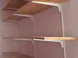 a shelf that has some shelves on it in a room