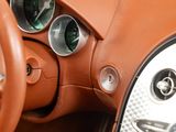 a close up of a steering wheel and dashboard of a car