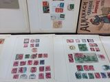 a lot of stamps on the pages of a book