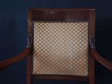 an image of a chair with a wooden frame and upholstered seat