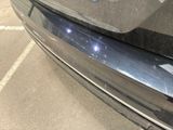 a close up of a car ' s bumper with a sticker on it