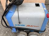 a blue and white machine that is sitting on the ground