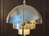 a lamp that is hanging from the ceiling in the room
