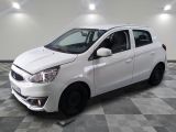 a picture of a white car parked in a garage