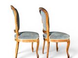 pair of chairs with upholstered back and upholstered seat
